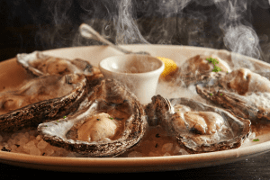 GW Fins in New Orleans, LA Smoked Sizzling Oysters DiRoNA Awarded Restaurant